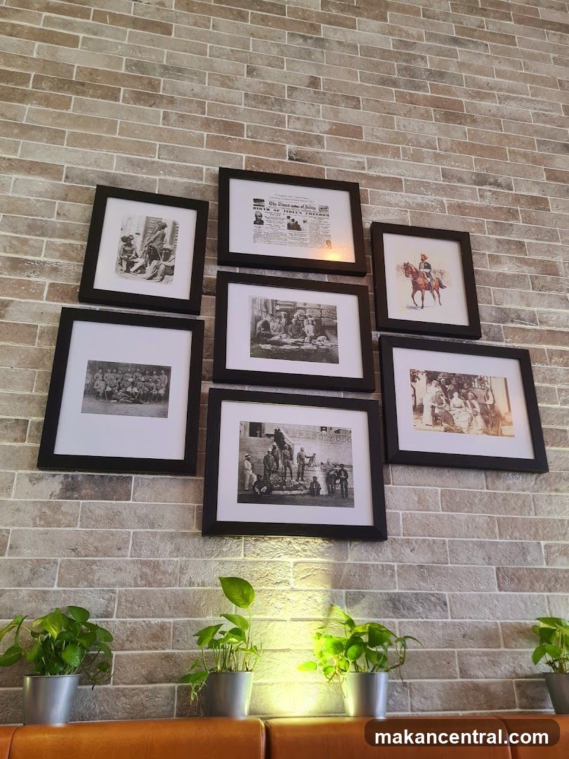 Framed historical photographs on a brick wall
