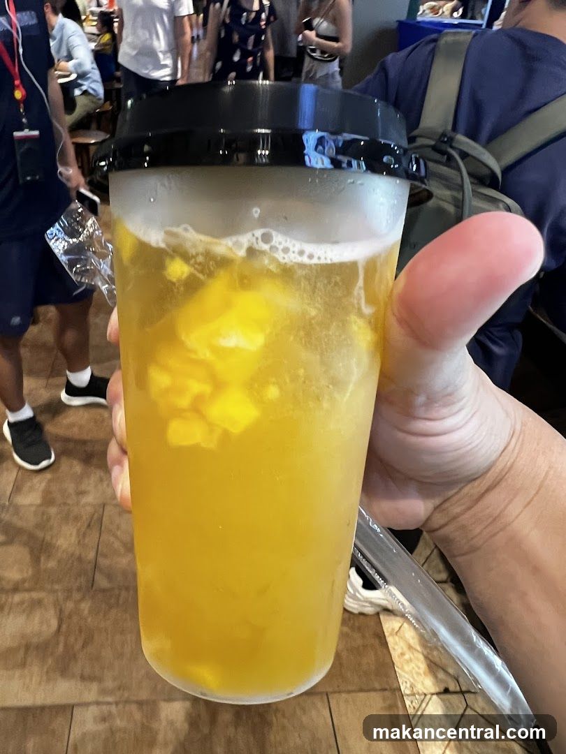 Yellow Drink with Fruit Pieces