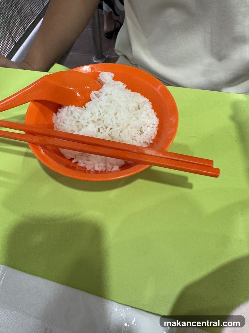 Steamed Rice with Chopsticks and Spoon