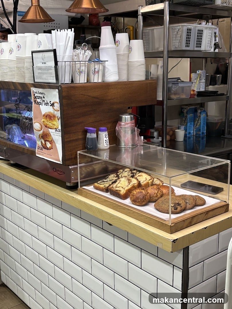 Cafe Counter with Pastries and Drinks