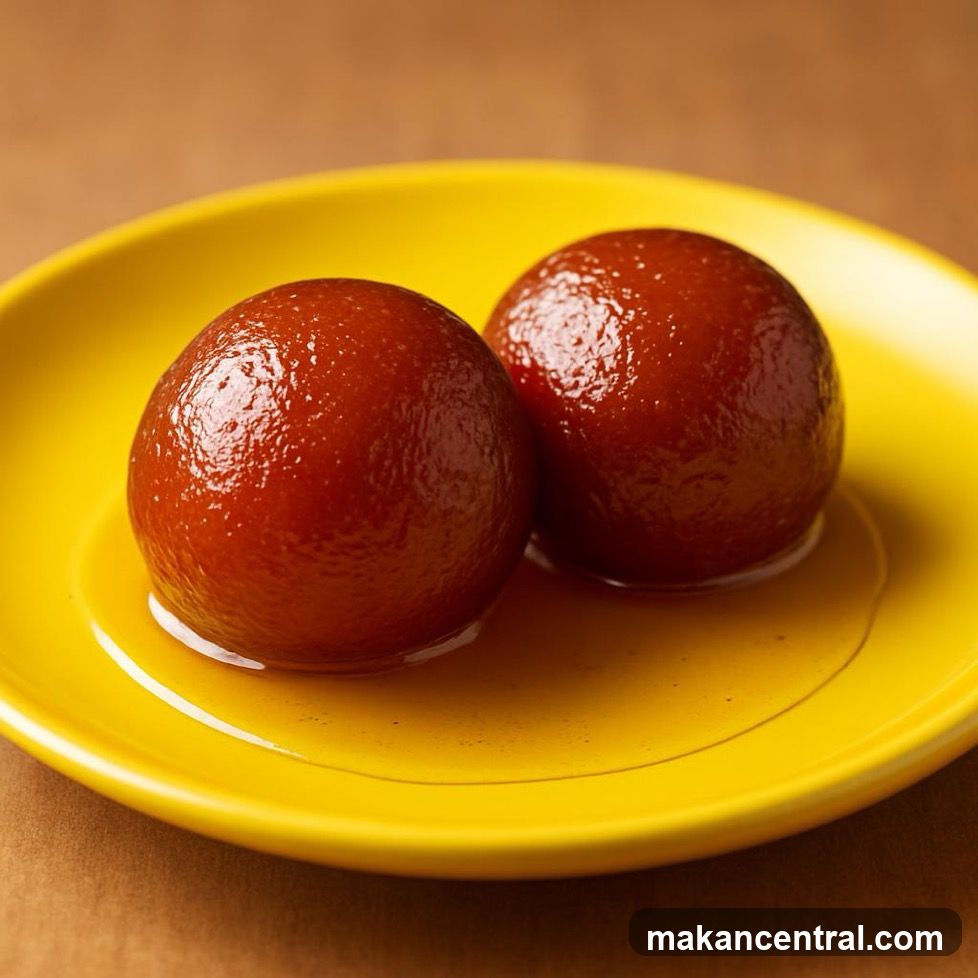 Gulab Jamun on a Yellow Plate