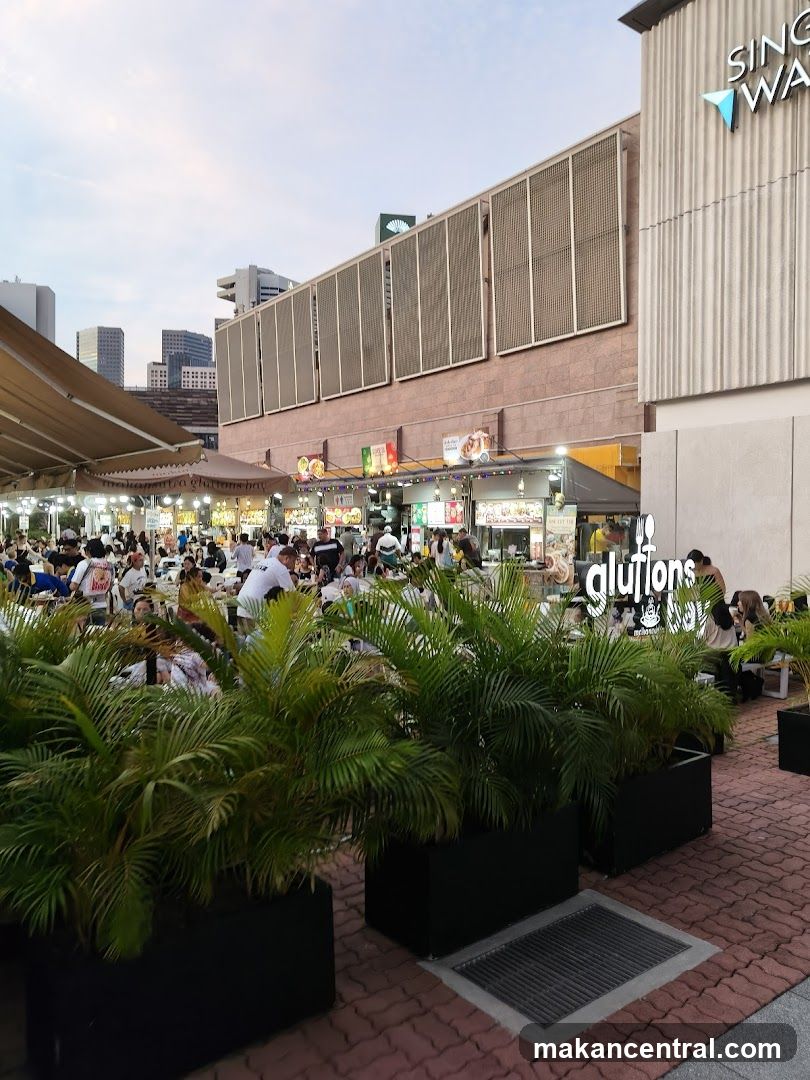Outdoor Food Court with Seating and Plants