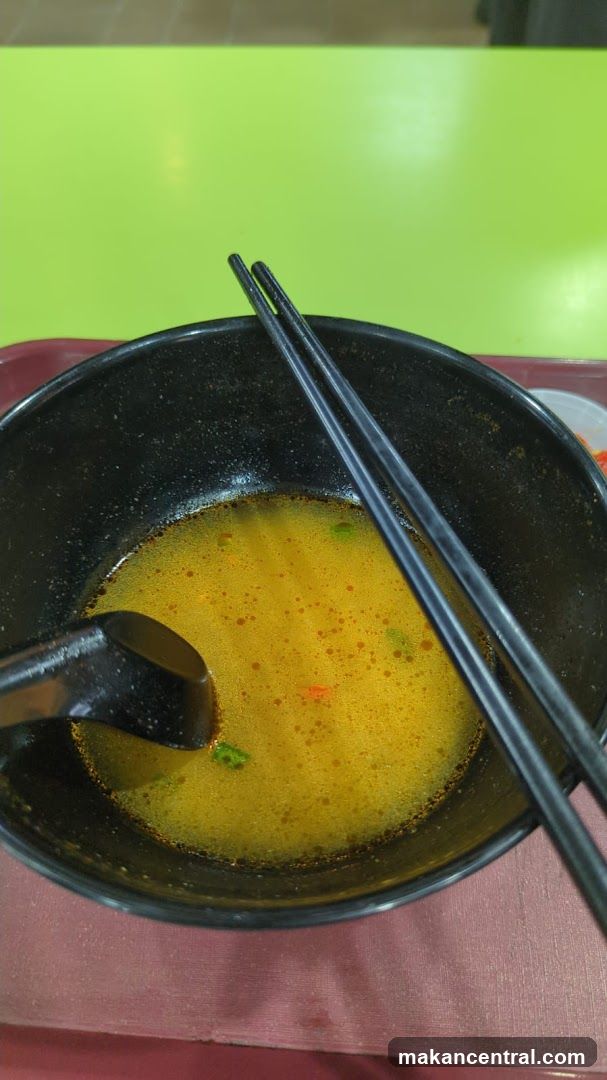 Bowl of Soup with Chopsticks