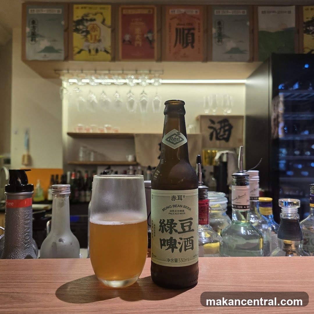 Beer Bottle and Glass on Bar