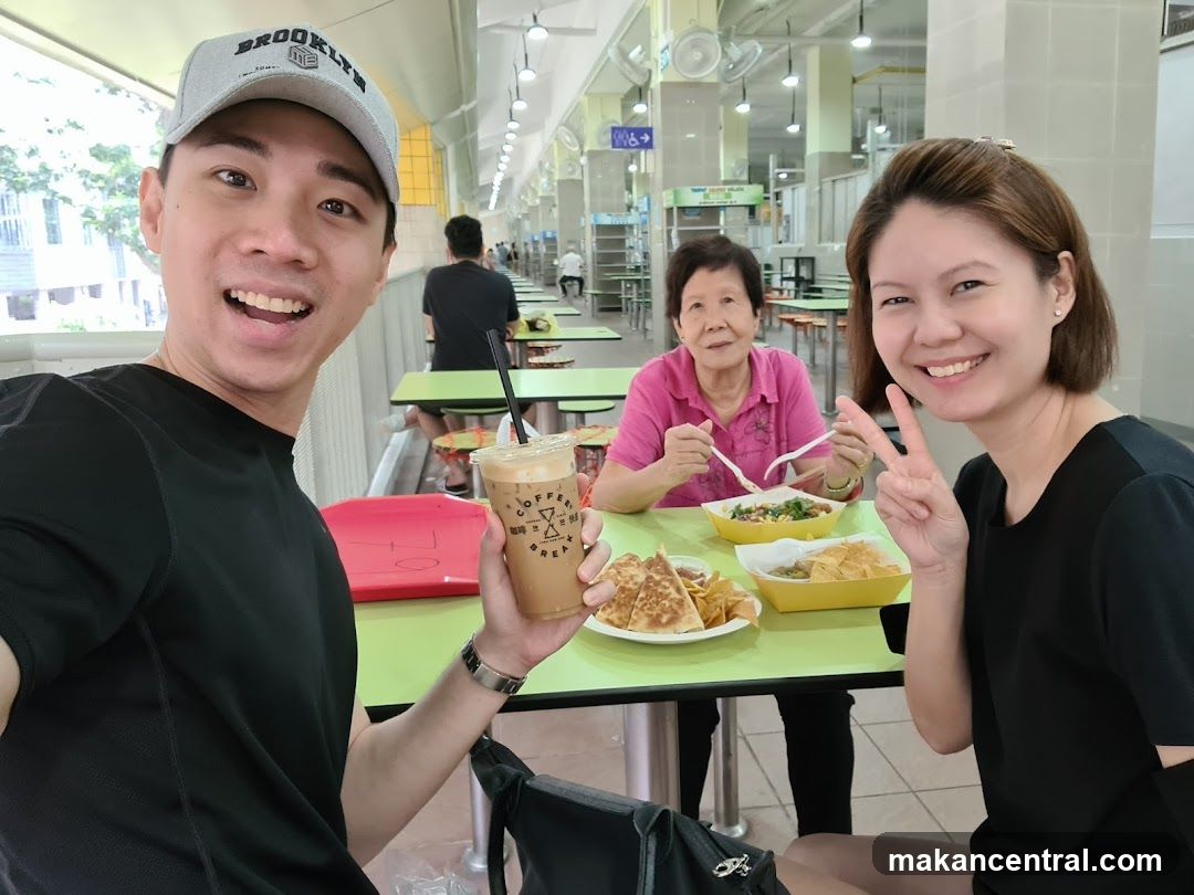 People enjoying food at a hawker center