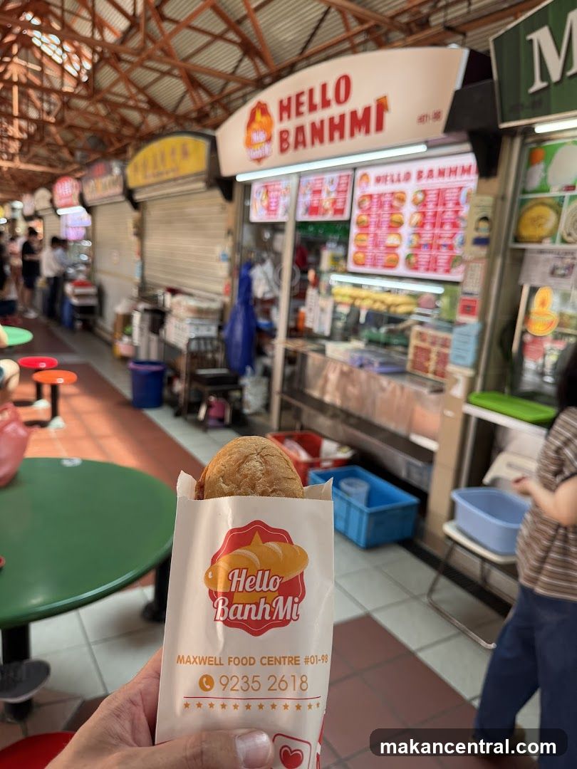 Person holding a Banh Mi sandwich bag