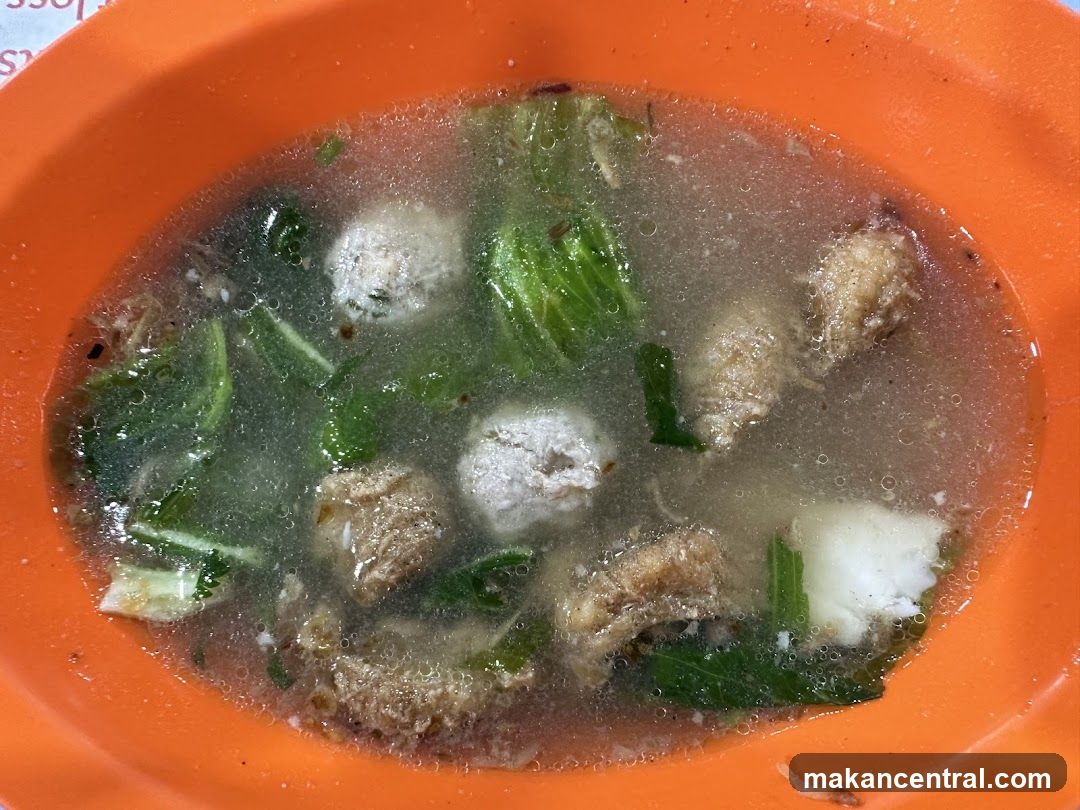 Bowl of Soup with Meatballs and Greens