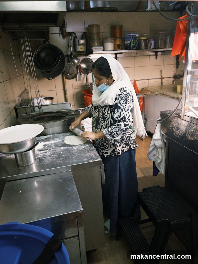 Woman preparing dough in a kitchen