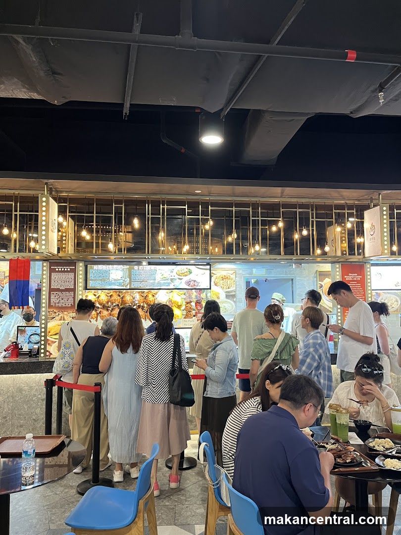 People queuing at a food stall