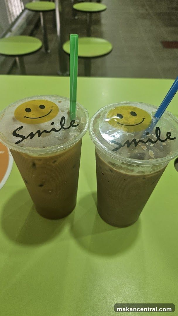 Two iced coffees with smiley face stickers