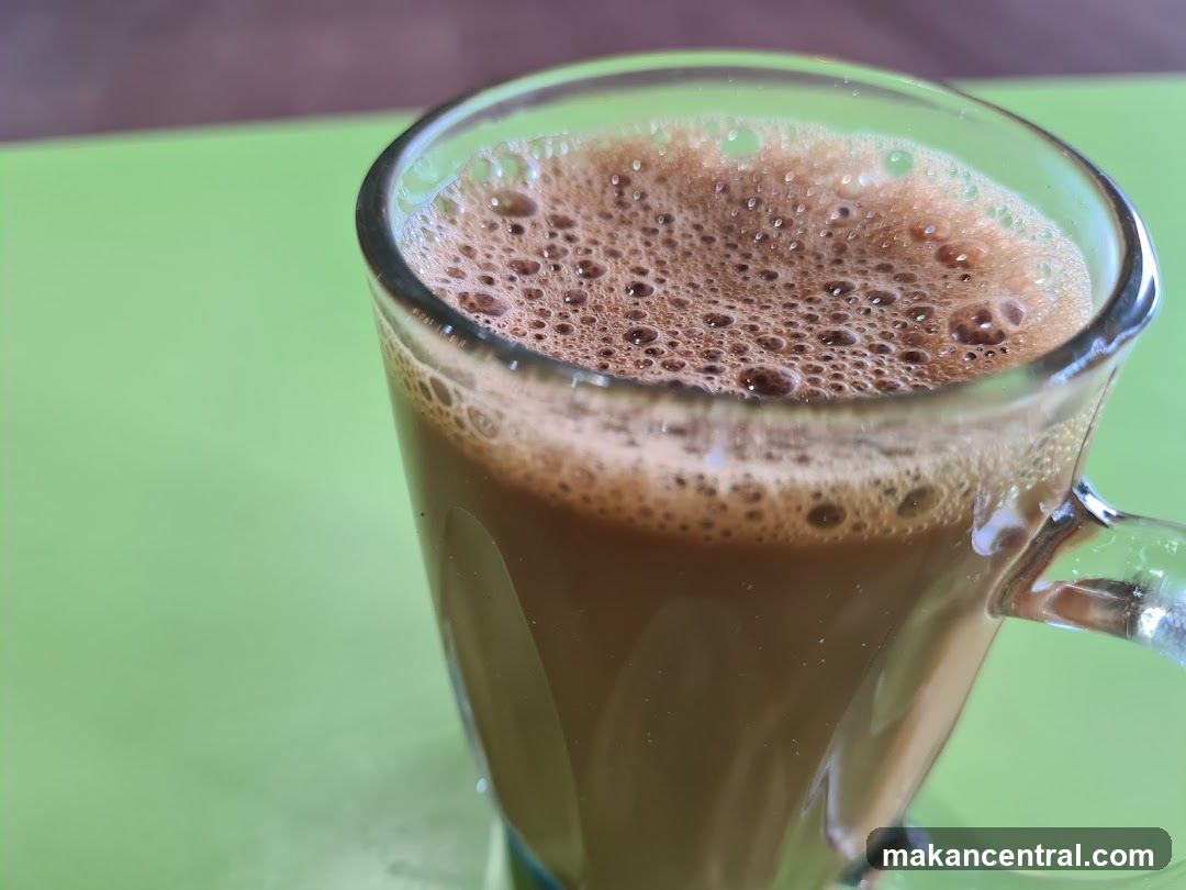 Frothy Coffee in a Glass Mug