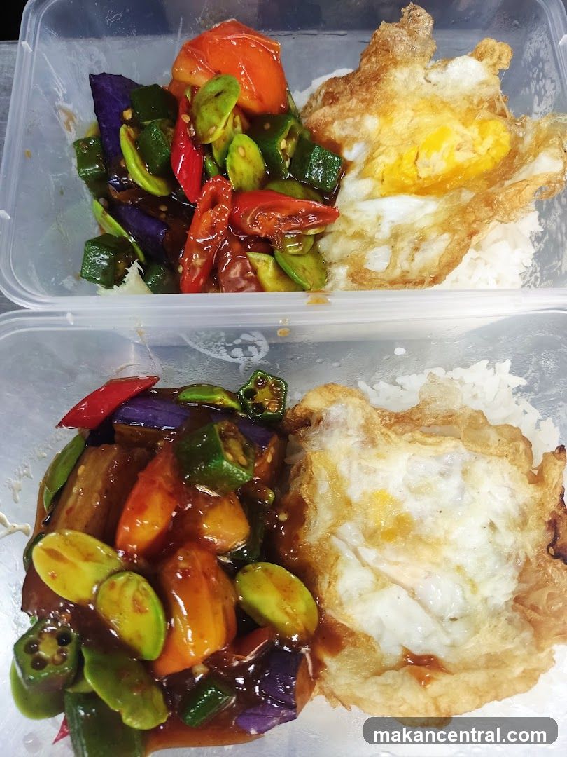 Two takeaway containers with rice and stir-fried vegetables
