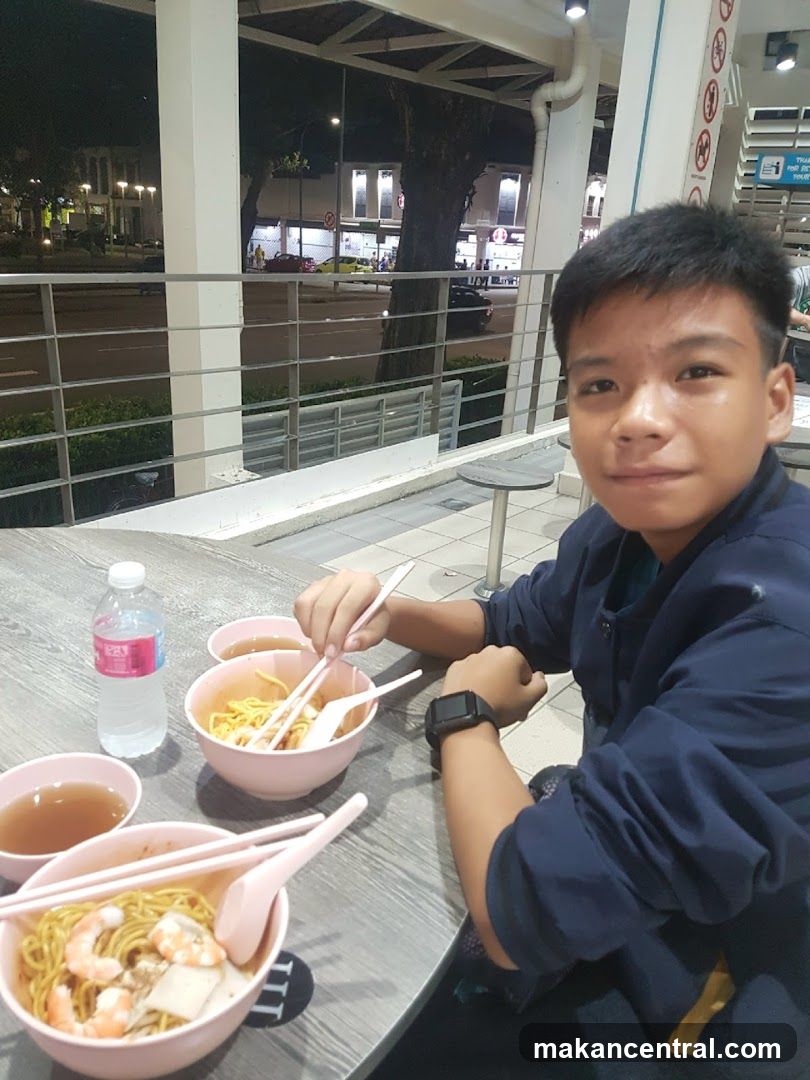 Boy eating noodles