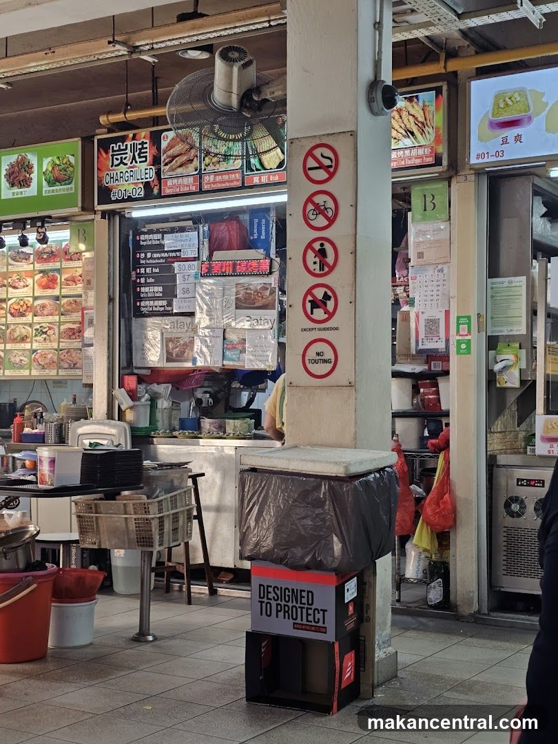 Food Stall with No-Touting Signs