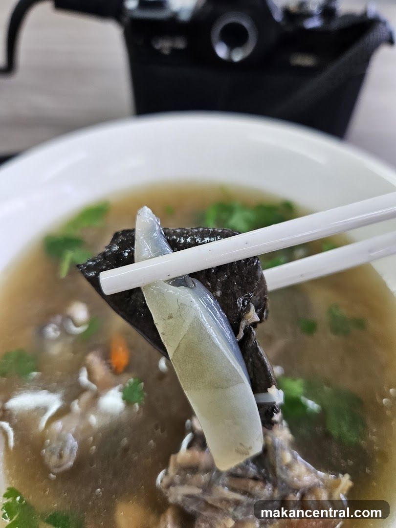 Close-up of Soup with Chopsticks