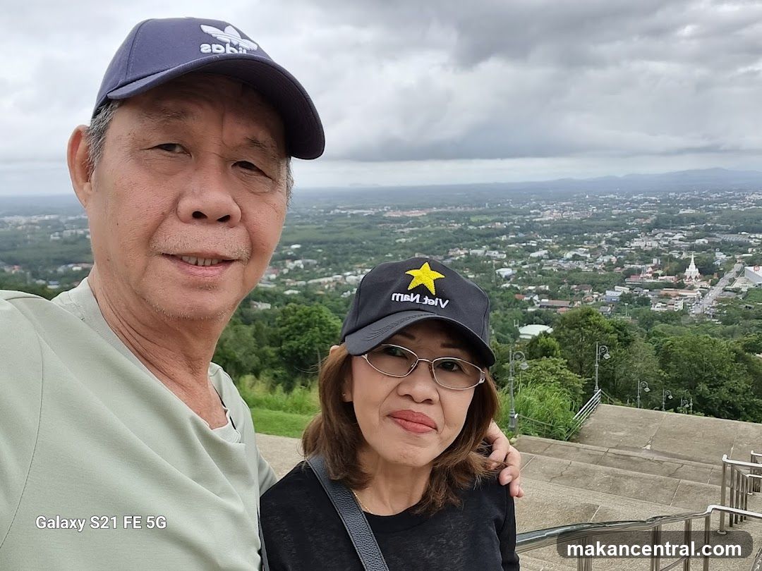 Couple Posing for a Selfie with a City View