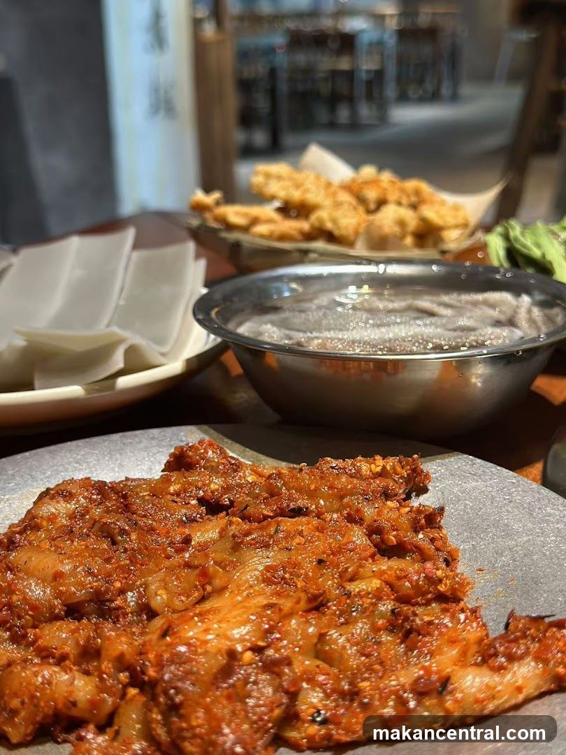 Spicy Meat Dish with Sides