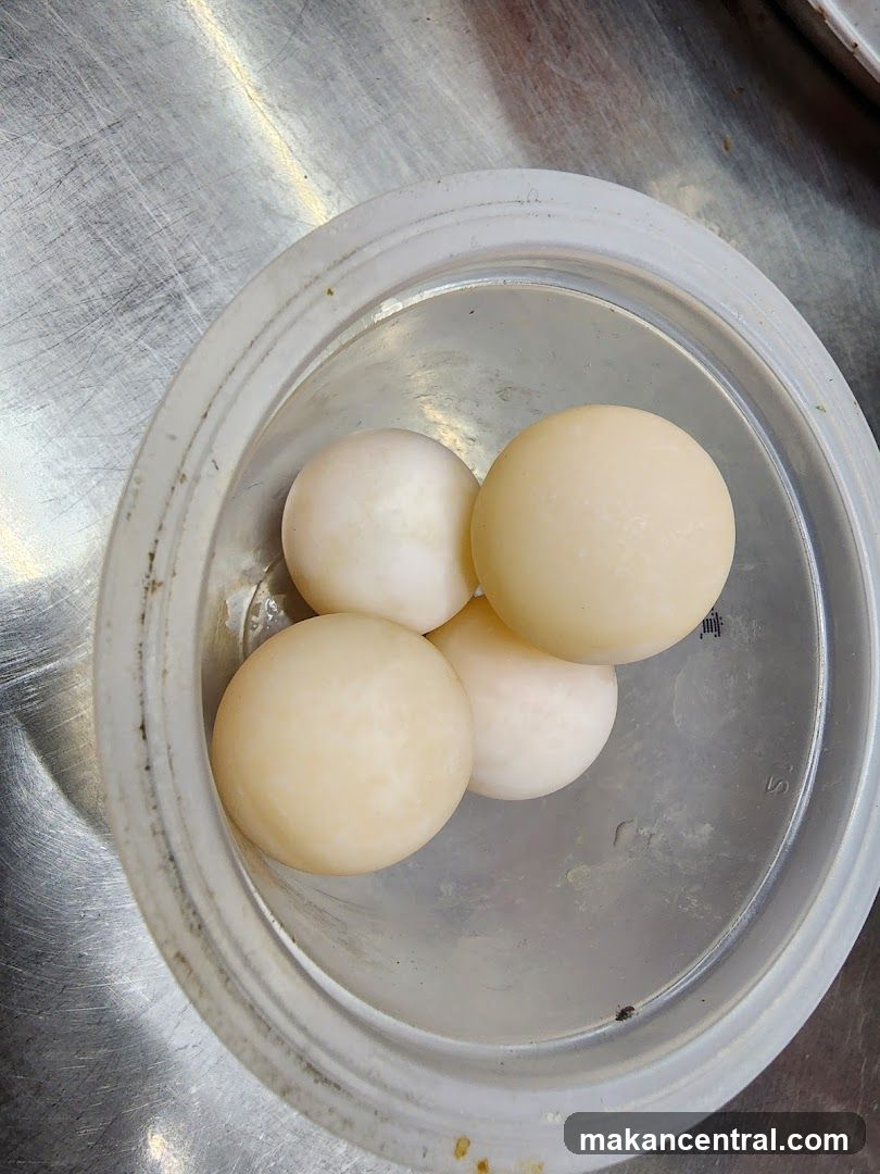 Four Eggs in a Container