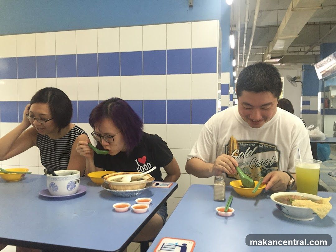 People eating at a food stall