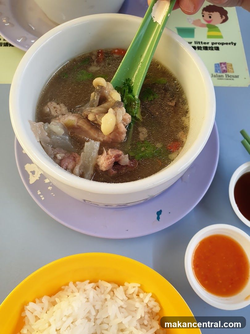 Bowl of soup with meat and rice