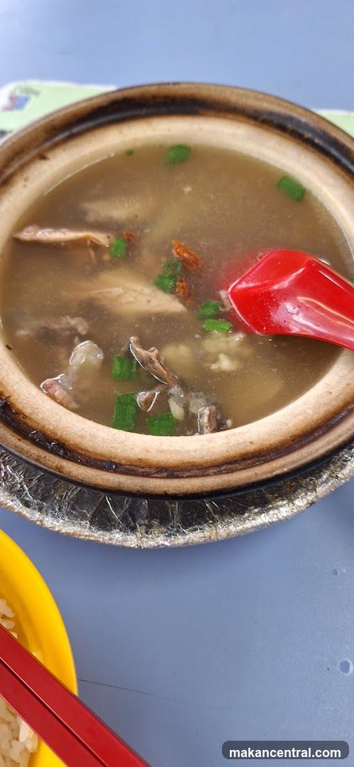 Bowl of soup with meat and herbs