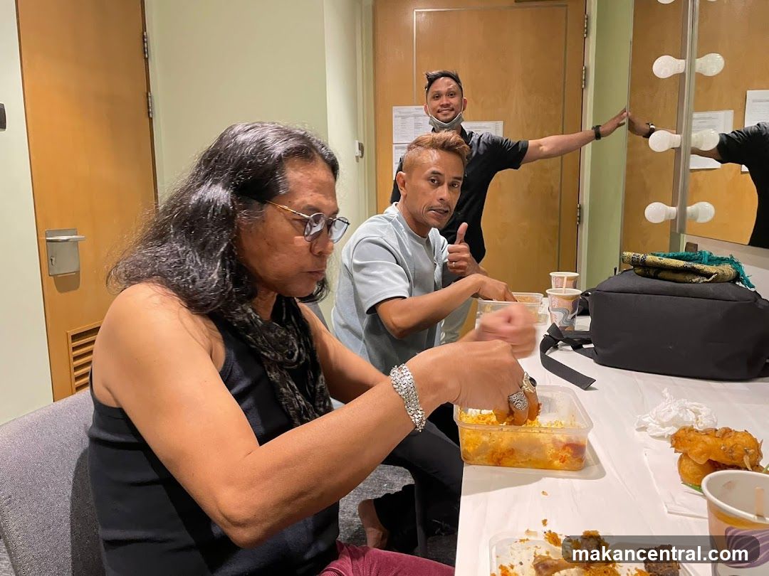 People eating in a dressing room