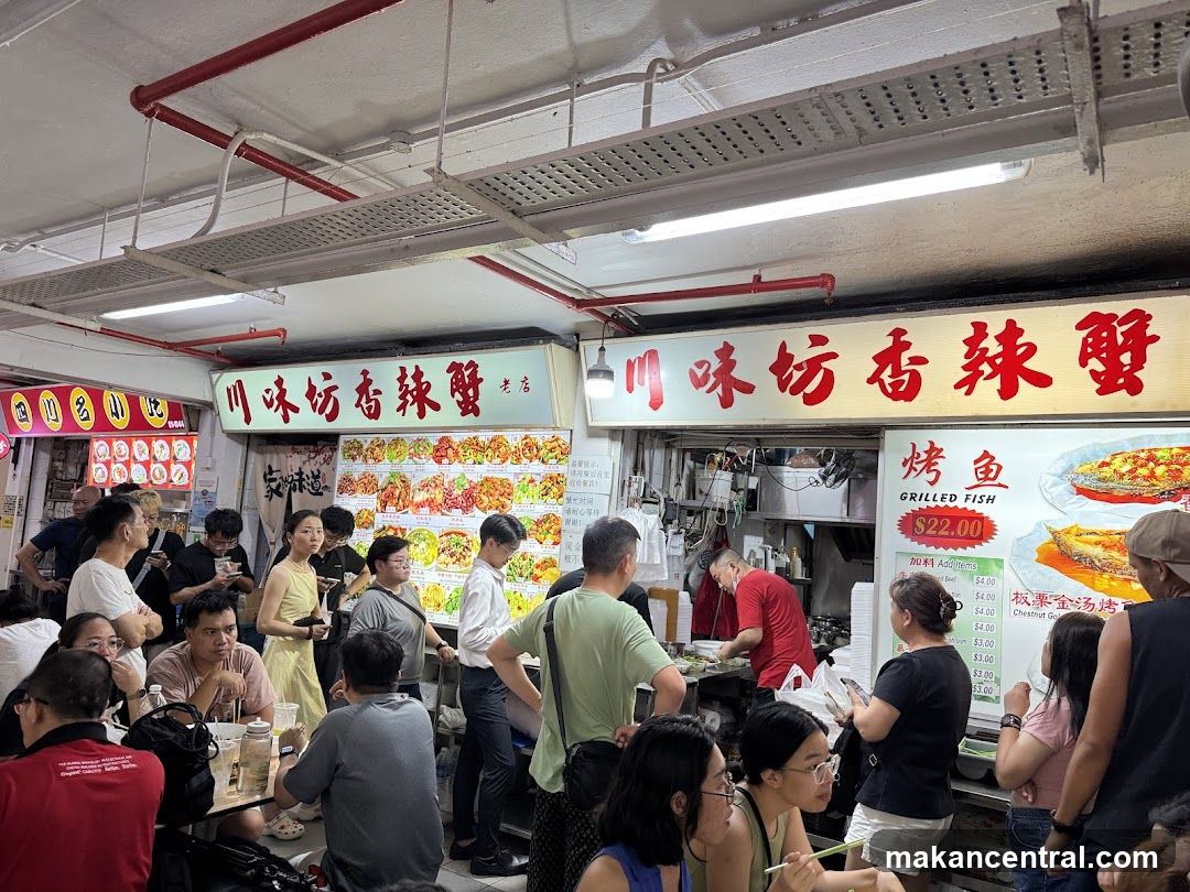 Busy Food Stall with Grilled Fish