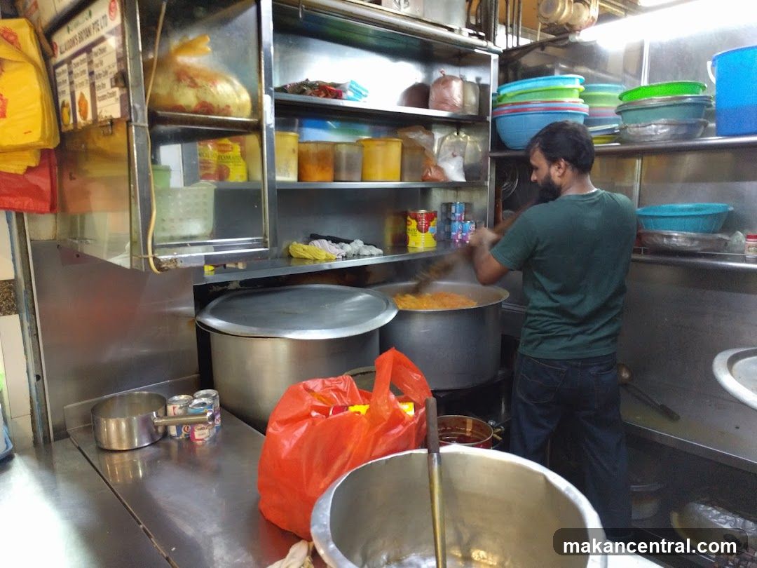 Cook preparing food in a commercial kitchen