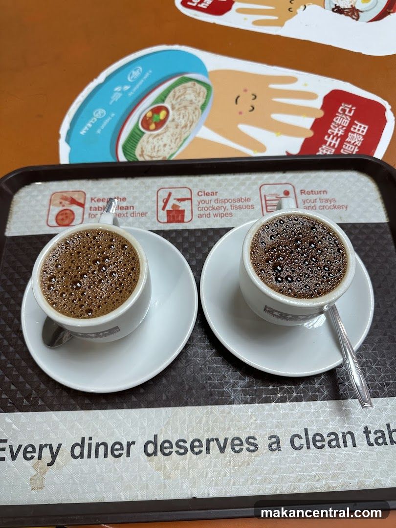 Two cups of coffee on a tray