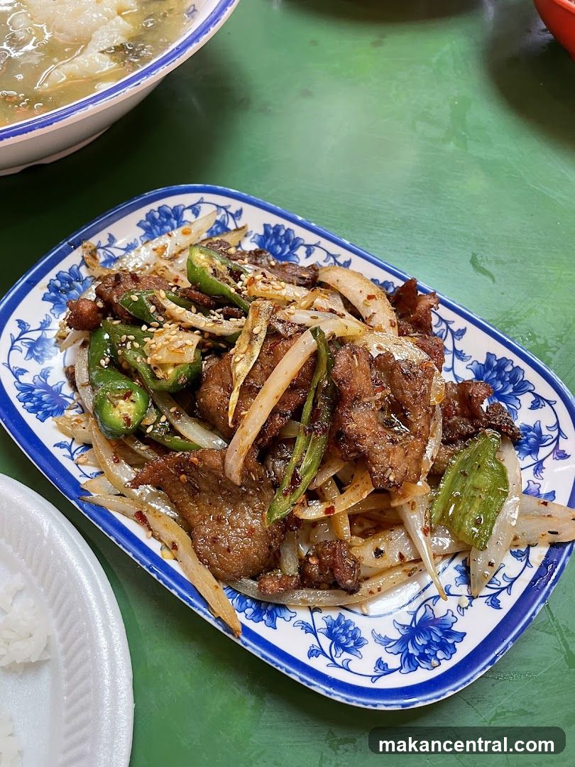 Spicy Stir-Fried Beef with Peppers and Onions