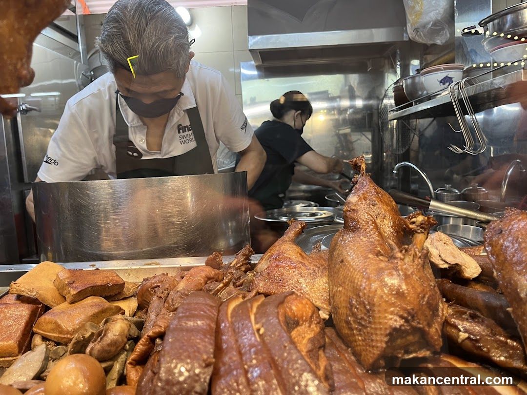 Cooks preparing food in a busy kitchen