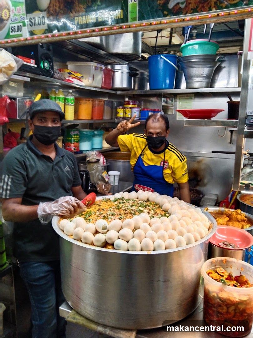 Food Stall with Two Men and a Large Pot of Food