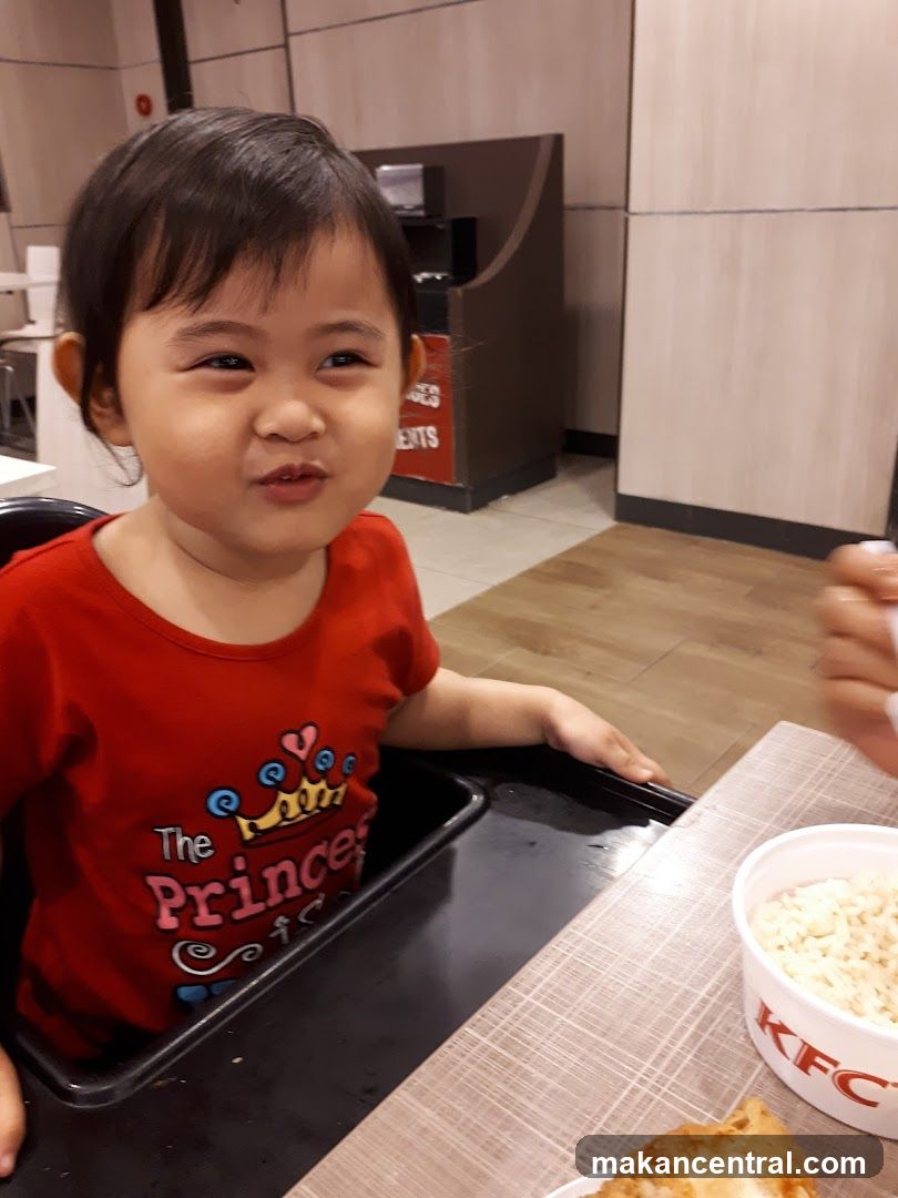 Child in a high chair at KFC