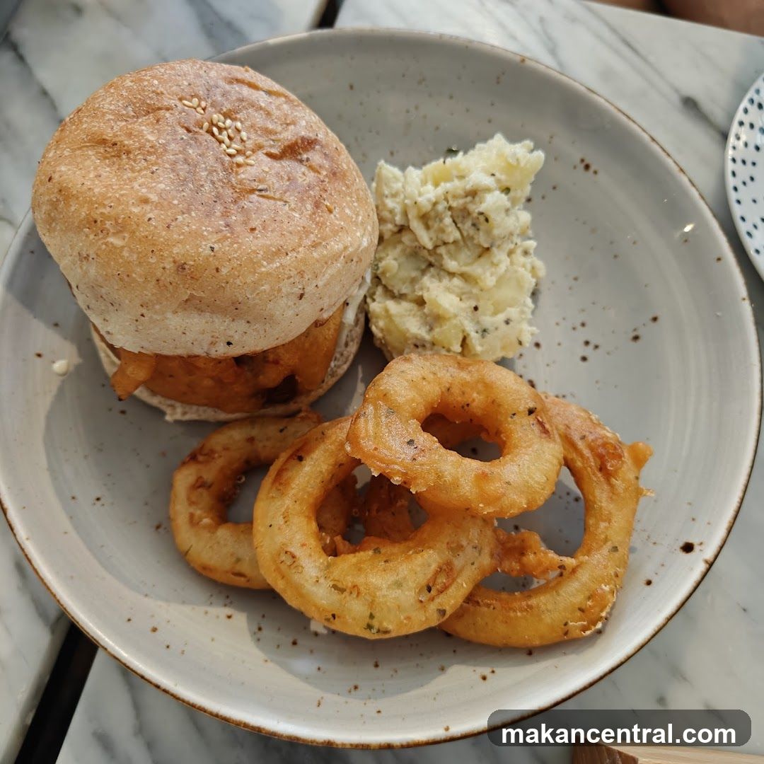 Burger with Onion Rings and Potato Salad