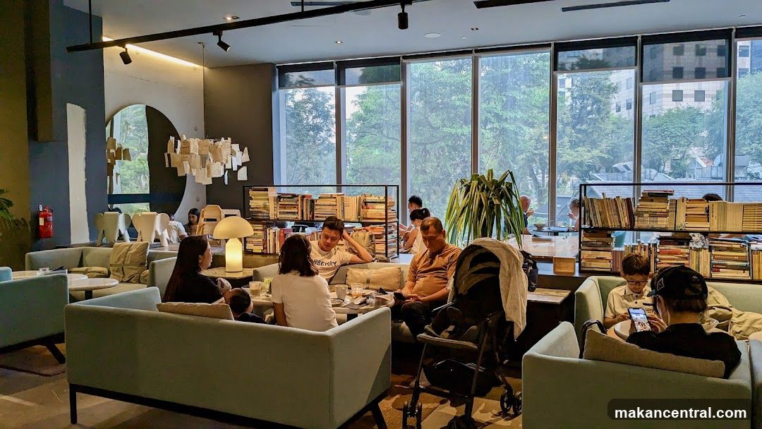 Cozy cafe interior with bookshelves and seating