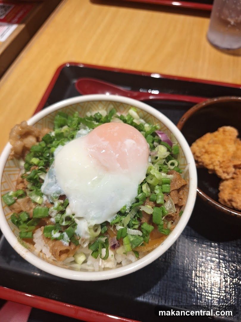 Beef bowl with egg and side of fried chicken