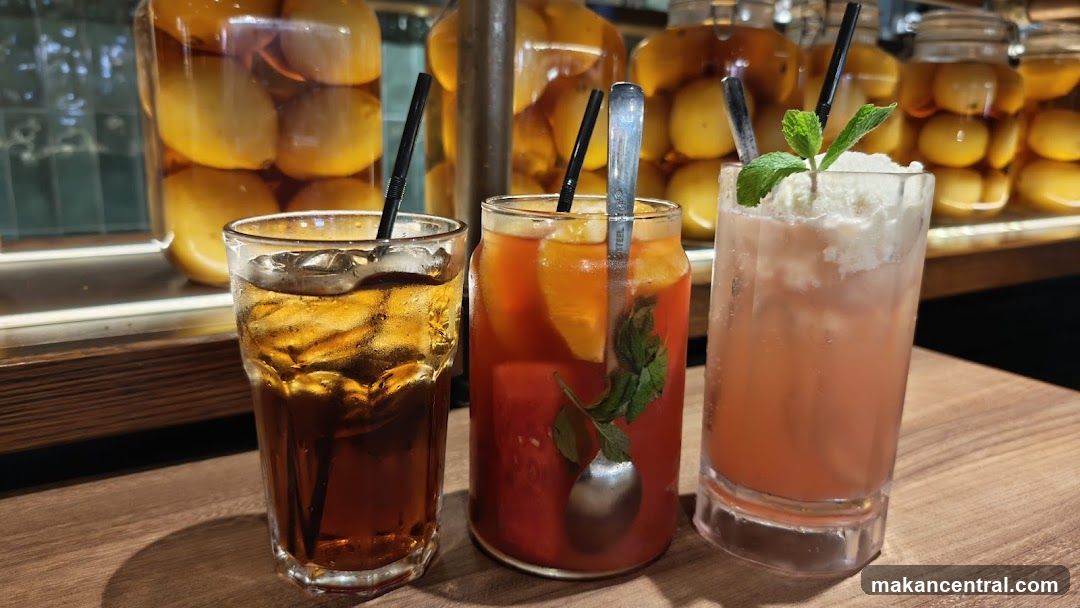 Three refreshing drinks on a wooden table