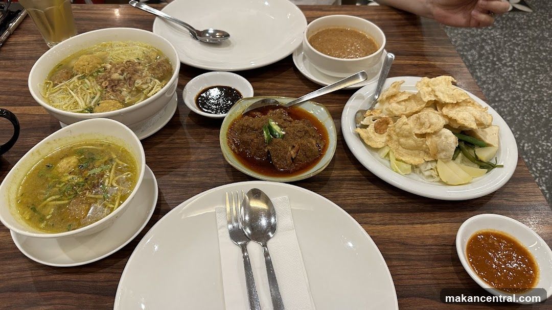 Table with various Indonesian dishes