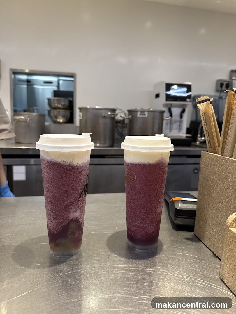 Two purple drinks on a counter