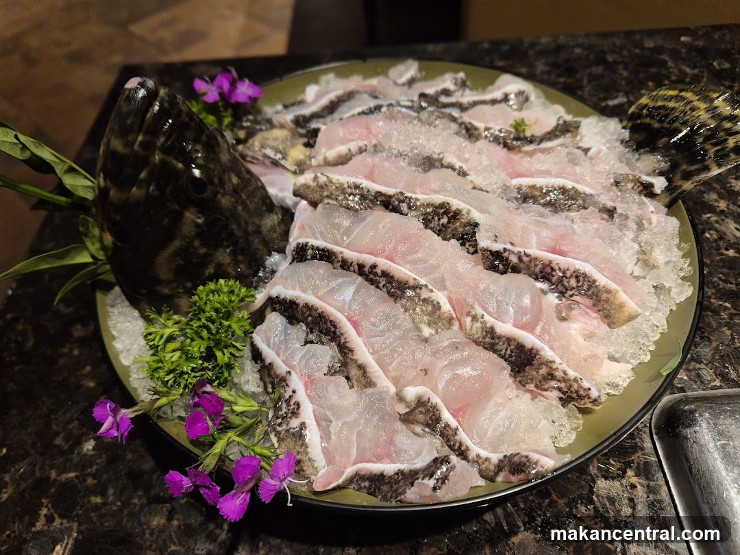 Sliced Fish on Ice with Garnish