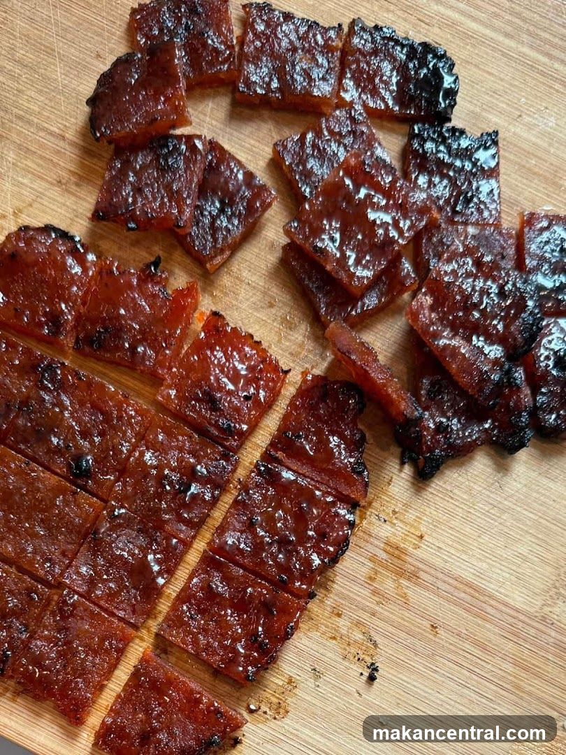 Cut Slices of Grilled Meat on Wooden Board