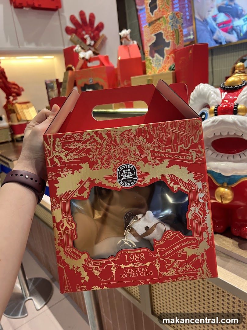 Hand holding red gift box