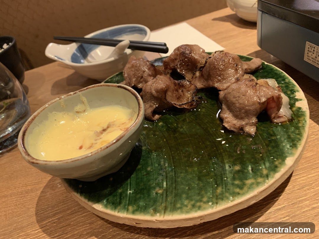 Dining Table with Grilled Meat and Sauce