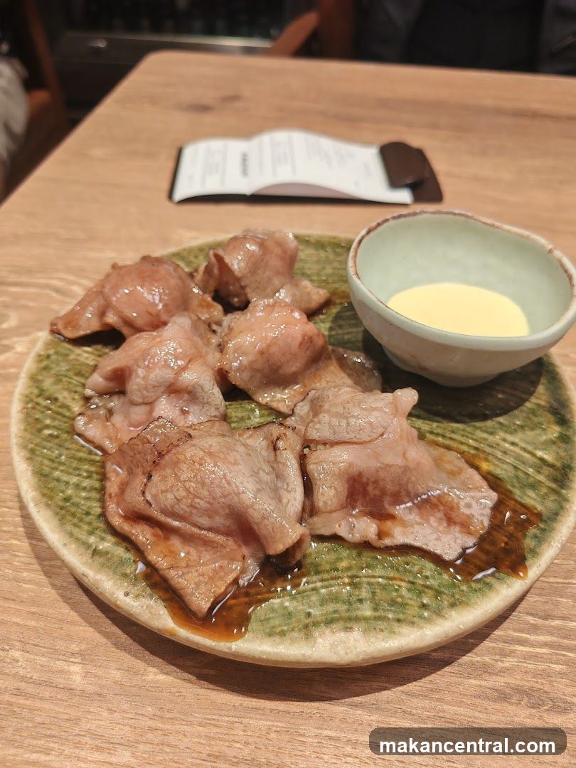 Food served on a plate with dipping sauce