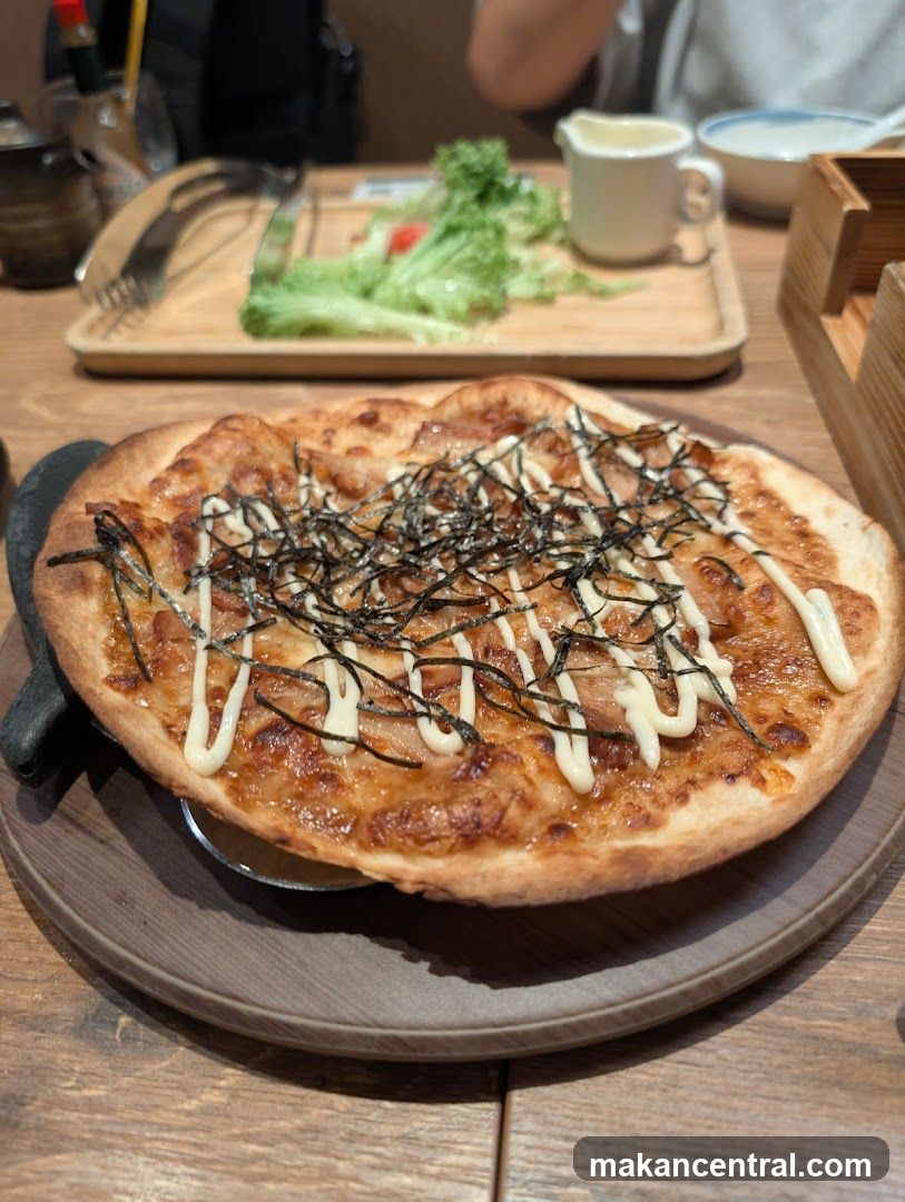 Pizza with toppings on wooden table