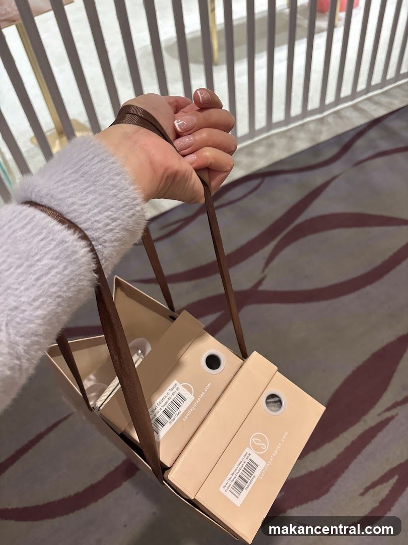 Hand holding shopping bags