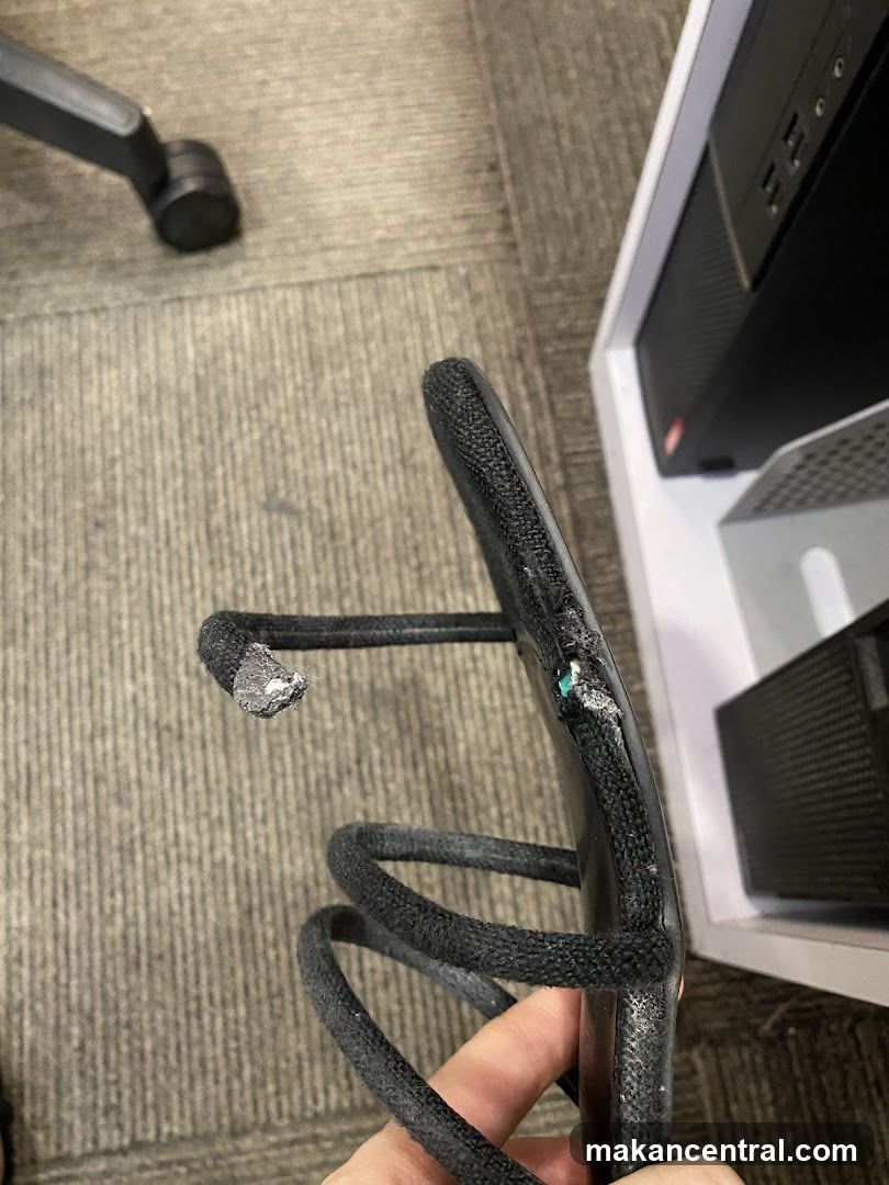 Damaged Cable Held in Hand