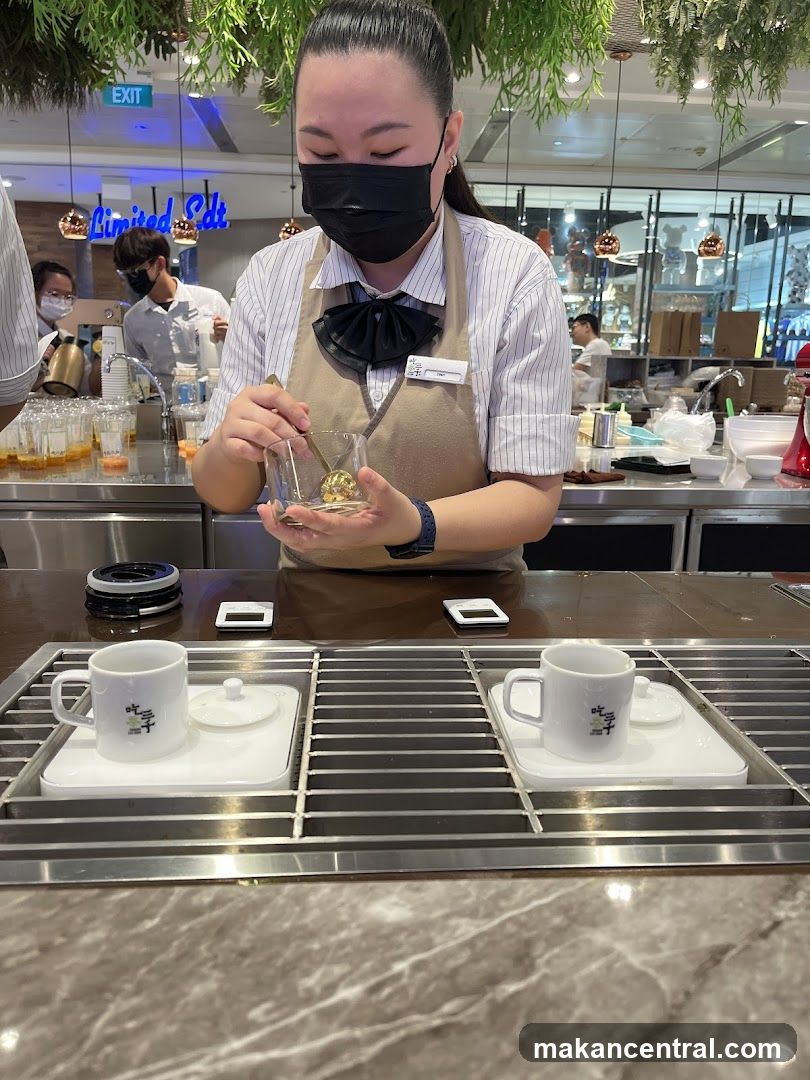 Staff preparing beverage