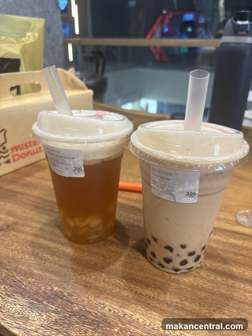 Two bubble tea drinks on wooden table