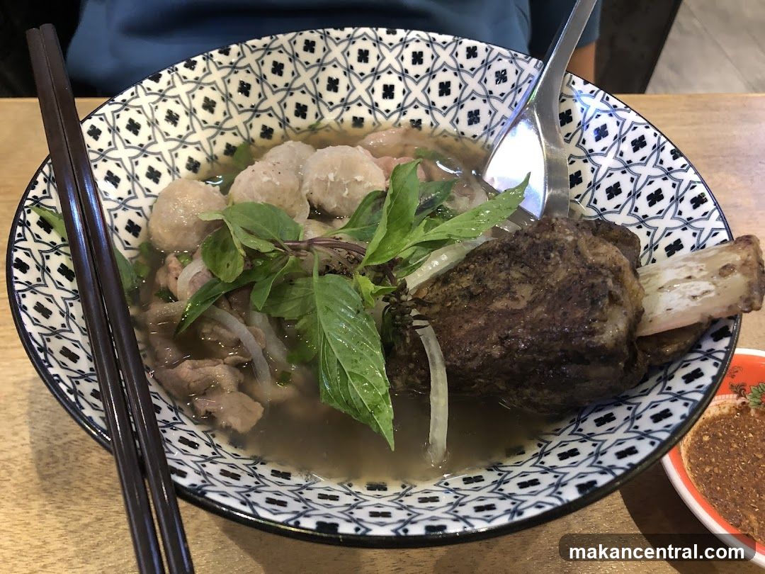 Bowl of Soup with Meatballs and Herb